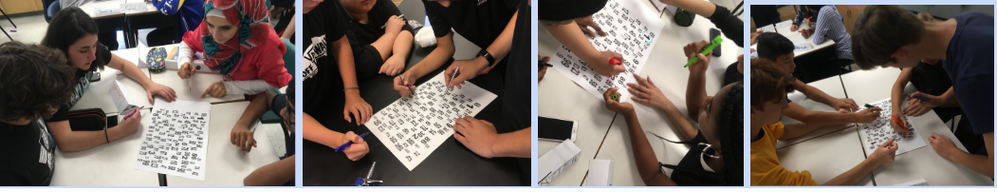 Picture of students working on white boards